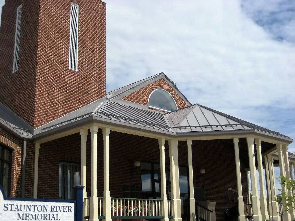 Skilled roofing craftsmen working on a residential roof in Spencerville